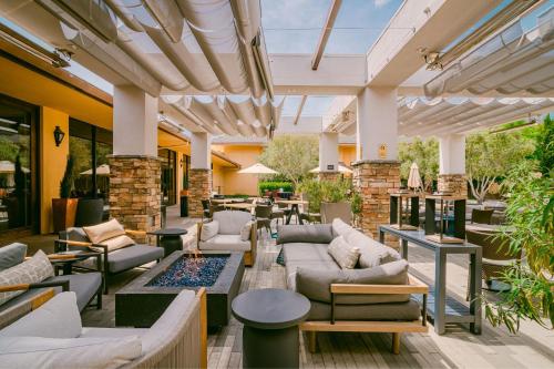an outdoor patio with couches and tables at Napa Valley Marriott Hotel & Spa in Napa