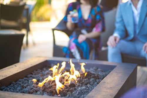 a group of people sitting around a fire pit at Napa Valley Marriott Hotel & Spa in Napa
