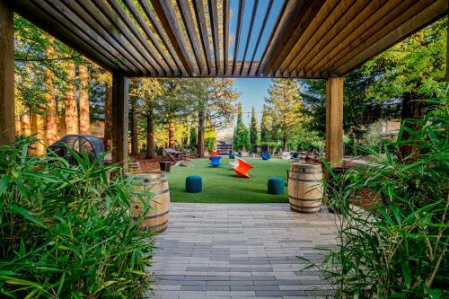 a covered patio with a garden with a playground at Napa Valley Marriott Hotel & Spa in Napa