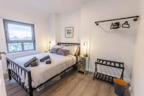 a bedroom with a large bed and a window at St. Edwards Hill in Sligo