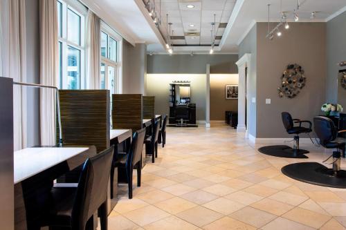 a salon with a row of tables and chairs at The Ballantyne, a Luxury Collection Hotel, Charlotte in Charlotte