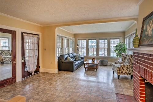 a living room with a couch and a fireplace at Lakewood Home with Yard about 8 Mi to Cleveland! in Lakewood