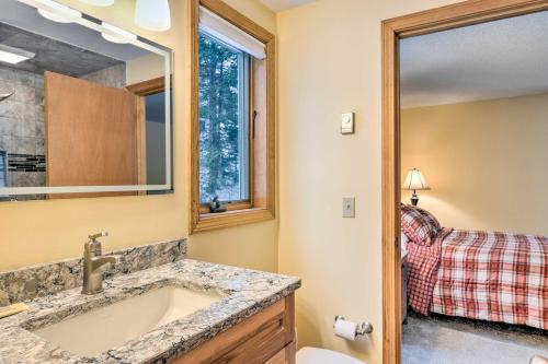 a bathroom with a sink and a mirror at Campton Home with Mountain Views Near Trails and Lake in Campton