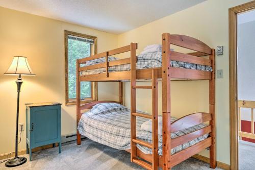 a bedroom with bunk beds in a house at Campton Home with Mountain Views Near Trails and Lake in Campton