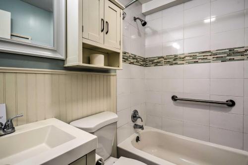 a bathroom with a sink and a toilet and a tub at Brigantine Vacation Rental - Walk to Beach! in Brigantine