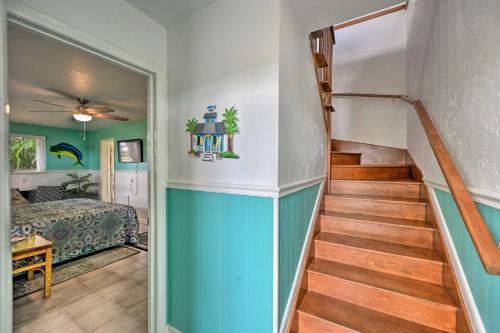 a hallway with a staircase leading to a bedroom at Everglades Getaway with Deck and Water Views! in Everglades City
