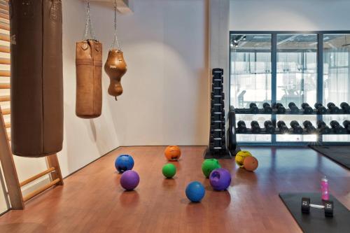a group of balls on the floor of a bowling alley at Moxy Amsterdam Houthavens in Amsterdam