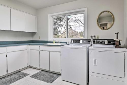 a white kitchen with white appliances and a window at Portland Area Home, 32 Mi to Mt Hood! in Damascus