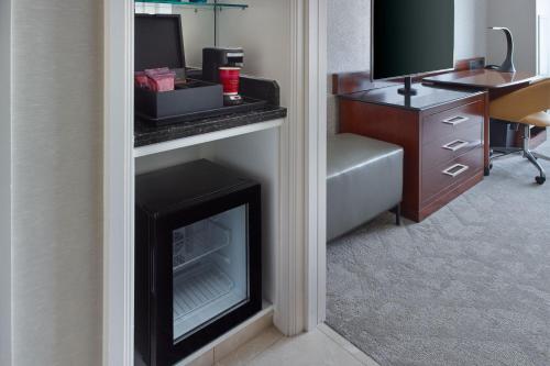 a living room with a fireplace in a hotel room at Atlanta Airport Marriott Gateway in Atlanta
