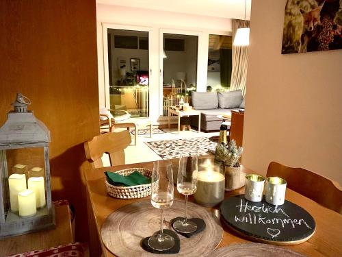 a dining room table with candles and wine glasses at FeWo Fuchs Saig in Lenzkirch