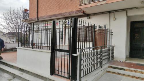 an iron gate on the side of a building at Tourist Rental Home ROMA in Rome