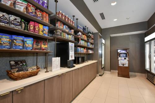 a grocery store with a counter and shelves of food at Residence Inn by Marriott Myrtle Beach Oceanfront in Myrtle Beach