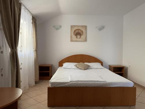 Postel nebo postele na pokoji v ubytování Vila Phoenix