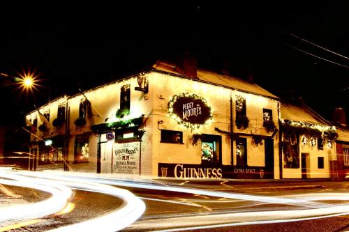 a building on the side of a street at night at Peggy Moores in Drogheda