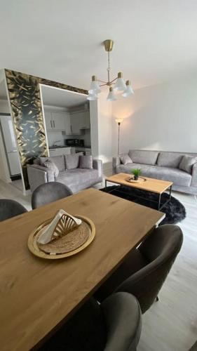 a table with a hat on top of it in a living room at Stunning Modern 2bed Apt Near Dublin City& Airport in Dublin