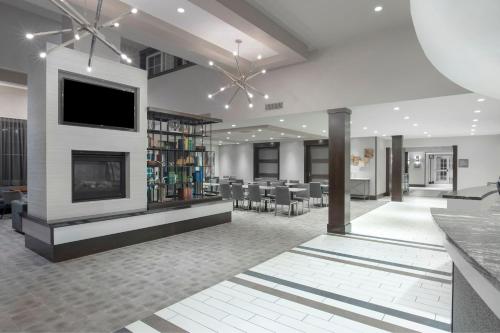 a living room with a fireplace and a tv at Residence Inn by Marriott Orangeburg in Orangeburg