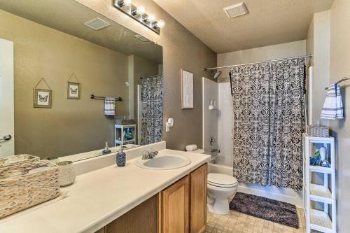 a bathroom with a sink and a toilet and a shower at Updated Denver Home, 6 Mi to Airport! in Aurora