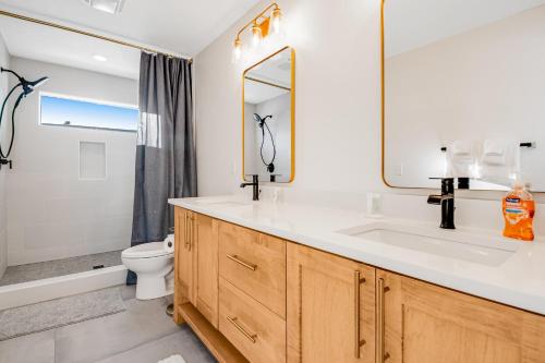 a bathroom with a sink and a toilet and a mirror at The Belle of Bear Lake in Fish Haven