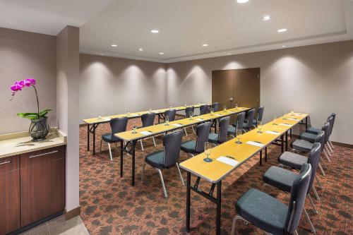 a conference room with a row of tables and chairs at Sheraton Vancouver Airport Hotel in Richmond