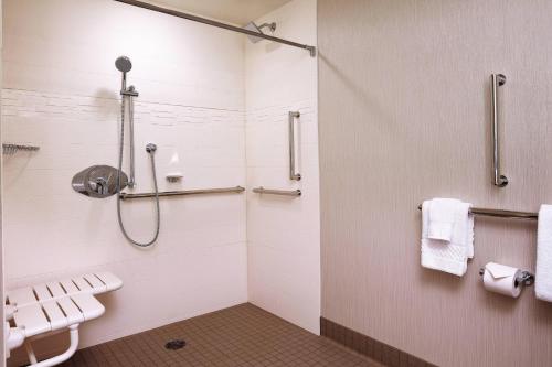 a bathroom with a shower and a toilet at Residence Inn by Marriott San Jose Cupertino in Cupertino