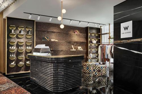 a dressing room with a counter and a rack of shoes at W Dubai - Mina Seyahi in Dubai