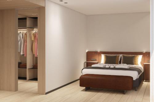 a bedroom with a bed and a walk in closet at Hotel Principe Avila in Lisbon