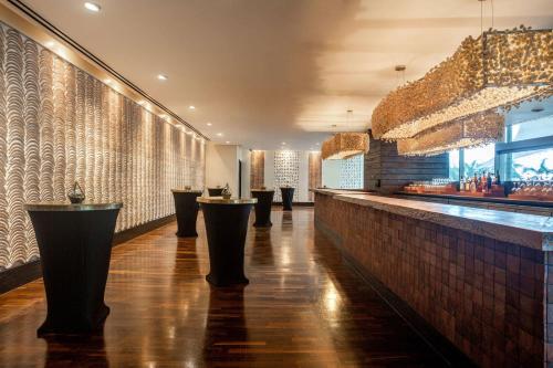 a bar with a row of stools in a restaurant at JW Marriott Panama in Panama City