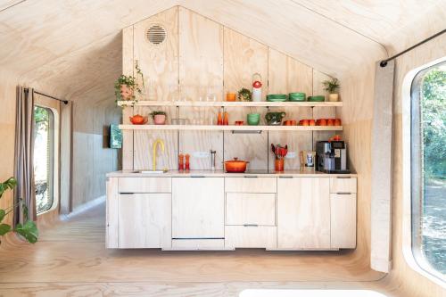 an interior view of a kitchen in a tiny house at les Cabanes d'Ostende in Ostend
