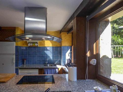a kitchen with a sink and a counter top at Casa Rural Yolanda para 5 personas in Arangas