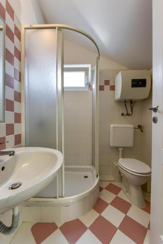 a bathroom with a shower and a sink and a toilet at Zara 2 in Kruševo