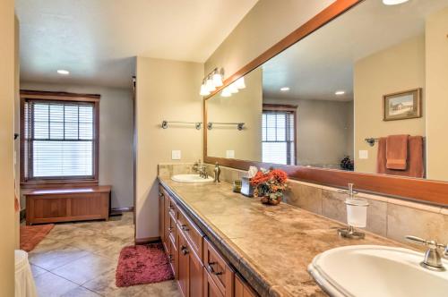 a bathroom with two sinks and a large mirror at Custom Home with Decks in Boulder! Gateway to Parks! in Boulder Town