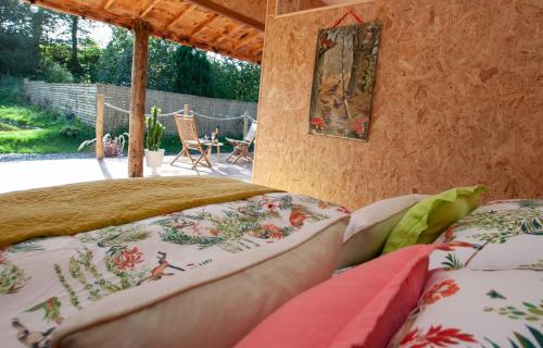 a bedroom with two beds and a picture on the wall at The Chard, Netherby, near Carlisle in Longtown