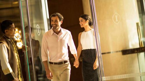 a man and a woman standing in front of a mirror at InterContinental Marine Drive Mumbai by IHG in Mumbai