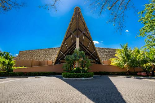 a building in front of a resort at Ciudad del Mar 104 in Jacó