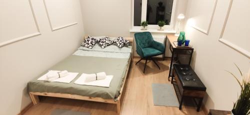 a small room with a couch and a chair at Apartament na Letniej 53m2 z Widokiem na Góry Kłodzko - Przyjaciół Ziemi Kłodzkiej in Kłodzko