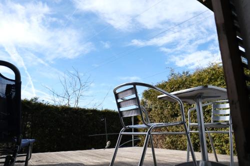 a stack of chairs sitting on a patio at Doppelzimmer in Innsbruck
