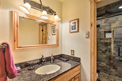 a bathroom with a sink and a mirror at Updated Condo with Views and Deck Less Than 1 Mi to Grand Lake in Grand Lake