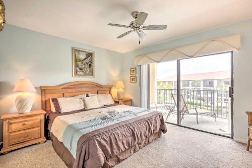 a bedroom with a bed and a balcony at Beachside St Augustine Vacation Rental Condo! in Coquina Gables