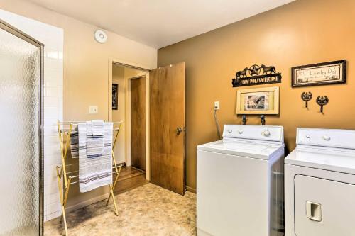 a laundry room with a washer and dryer at South Dakota Vacation Rental Near Mount Rushmore in Hermosa