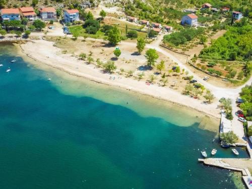 an aerial view of a beach with blue water at Zara 2 in Kruševo