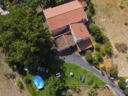 an overhead view of a house with a pool at Villa Nadira in Giardini Naxos