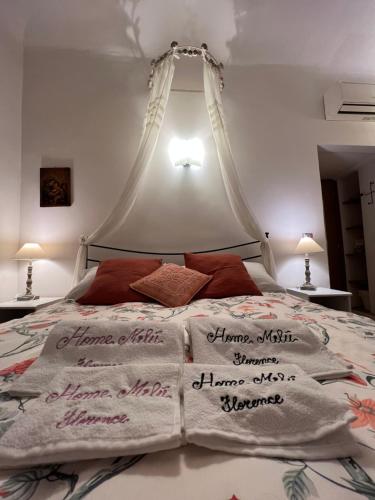 Ein Bett oder Betten in einem Zimmer der Unterkunft Home Milù Florence