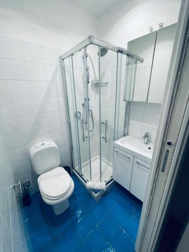 a bathroom with a shower and a toilet and a sink at Bella Tao in Taormina