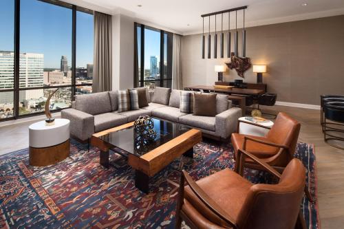 a living room with a couch and a table at The Westin Oaks Houston at the Galleria in Houston