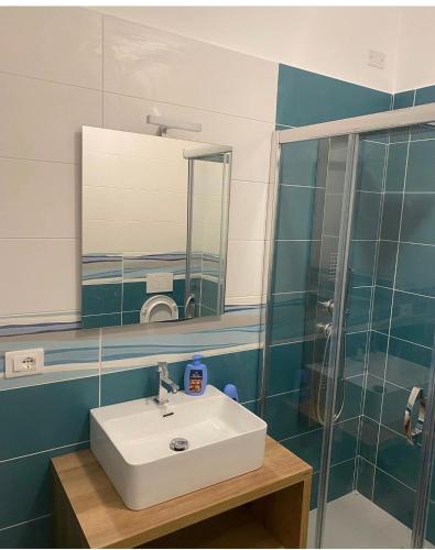 a bathroom with a sink and a mirror at Dimora Leone in Diamante