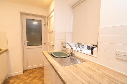 a kitchen with a sink and a counter top at south view in Bournemouth