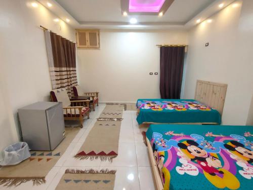 Ένα ή περισσότερα κρεβάτια σε δωμάτιο στο Nubian Ounaty