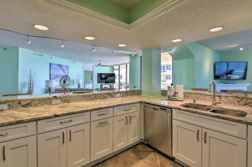 a large kitchen with two sinks and a large mirror at Gulf View Destin Condo with Resort Pool and Spa! in Destin