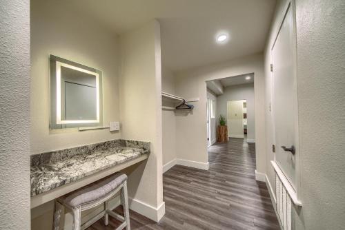 a hallway with a large sink and a mirror at CW CH Camp Warnecke Club Haus in New Braunfels