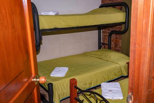 Cama o camas de una habitación en Ecovilla Cali